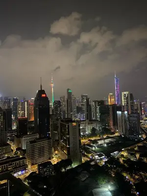a view of a city at night with at Kuala Lumpur Infinity Skypool hostel in Kuala Lumpur