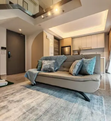 a living room with a couch with pillows on it at Residensi Agile Delima by Times 8 in Kuala Lumpur