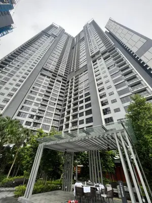 a tall building with tables in front of it at Residensi Agile Delima by Times 8 in Kuala Lumpur