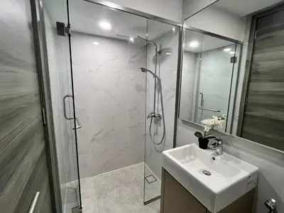 a bathroom with a glass shower and a sink at Residensi Agile Delima by Times 8 in Kuala Lumpur
