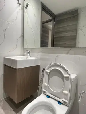 a white bathroom with a toilet and a sink at Residensi Agile Delima by Times 8 in Kuala Lumpur