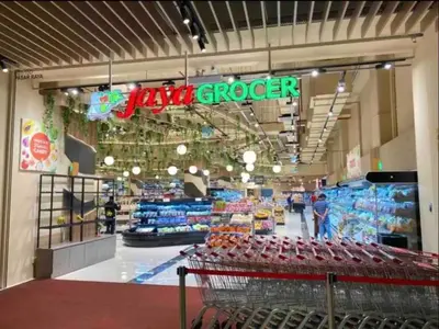 a grocery store with a cart in the aisle at BEST 4-5pax KL Amazing View SkyPool Bukit Bintang in Kuala Lumpur