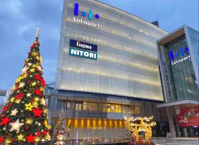a christmas tree in front of a hotel at BEST 4-5pax KL Amazing View SkyPool Bukit Bintang in Kuala Lumpur