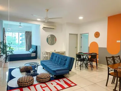 a living room with a blue couch and a table at 2Room 8pax Link to Velocity Mall MRT KL in Kuala Lumpur