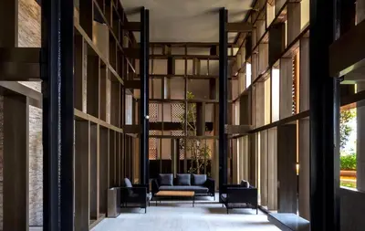 a hallway with a couch and chairs in a building at Lucentia Residences by Luxe Suites in Bukit Bintang KLCC! in Kuala Lumpur