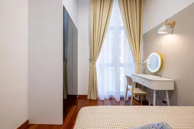 a bedroom with a bed and a sink and a mirror at Le Luxe de KL 2BR with Bath Tub 10 min to KLCC in Kuala Lumpur