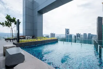 a swimming pool on the roof of a building at Le Luxe de KL 2BR with Bath Tub 10 min to KLCC in Kuala Lumpur