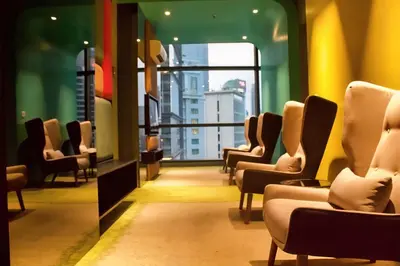a waiting room with chairs and a window at 03 Tribeca Serviced Suites I 5 min to Pavilion KL I 2R1B I TRX Tower View in Kuala Lumpur
