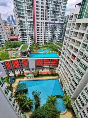 an overhead view of a pool in a city with tall buildings at Big Group 3R2B Sunway Velocity KL Walking distance to Monorail in Kuala Lumpur
