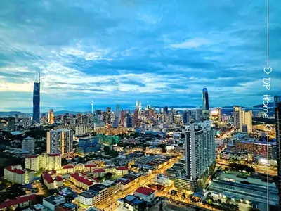 a view of a large city at night at Luxury Homestay KL Center 6-8pax TRX-Velocity-Ikea in Kuala Lumpur