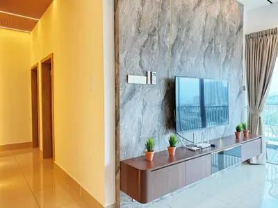 a living room with a tv on a wall at D3911 Klcc View Private Roof Terrace l 8Pax in Kuala Lumpur