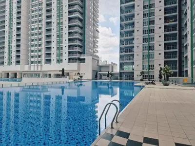 a large swimming pool with two tall buildings at D3911 Klcc View Private Roof Terrace l 8Pax in Kuala Lumpur