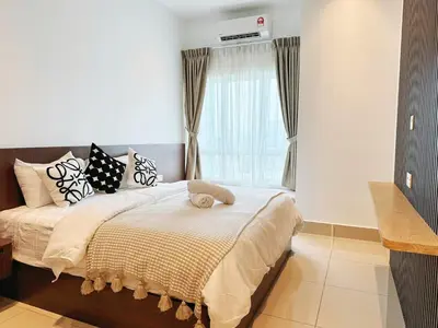 a bedroom with a bed and a window with a heater at D3911 Klcc View Private Roof Terrace l 8Pax in Kuala Lumpur