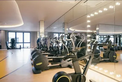 a gym with rows of exercise equipment in a building at M Vertica E33A10 l 4 Bedroom l 8 Pax in Kuala Lumpur