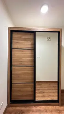a large wooden closet with a glass door at 2BR 4PAX Stylish Duplex ARTE Mont Kiara in Kuala Lumpur