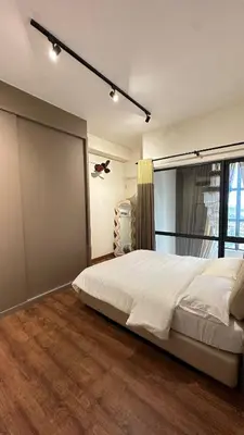 a bedroom with a large white bed and a window at 2BR 4PAX Stylish Duplex ARTE Mont Kiara in Kuala Lumpur