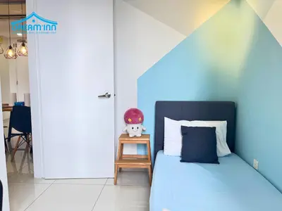 a bedroom with a bed and a table with a stuffed animal at The Robertson Bukit Bintang KLCC by Dream'Inn in Kuala Lumpur