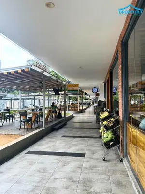a food court with tables and chairs on a building at The Robertson Bukit Bintang KLCC by Dream'Inn in Kuala Lumpur