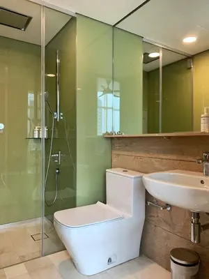 a bathroom with a toilet and a sink and a shower at Sky Suites KLCC Level 58 in Kuala Lumpur
