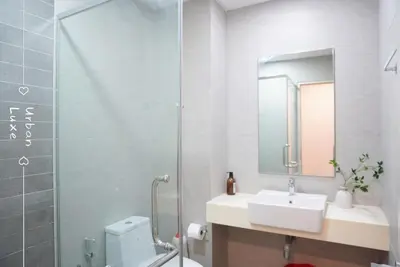 a bathroom with a toilet and a sink and a shower at Vivo Suite 4 pax 2 bed Studio in Kuala Lumpur