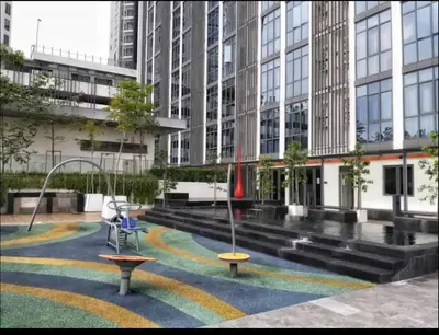a playground in front of a large building at Vivo Suite 4 pax 2 bed Studio in Kuala Lumpur