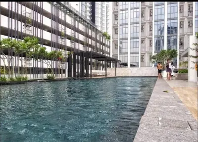 a pool of water in front of a building at Vivo Suite 4 pax 2 bed Studio in Kuala Lumpur