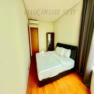 a bedroom with a bed with a sign that reads walk home sap at Sky suites klcc by Elham in Kuala Lumpur