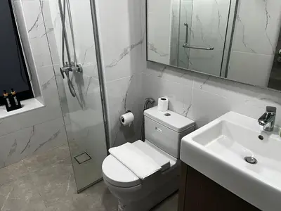a bathroom with a toilet and a sink and a shower at Agile Residence Service Suites Bukit Bintang KL in Kuala Lumpur