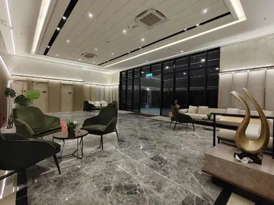 a lobby with chairs and a couch and tables at Agile Residence Service Suites Bukit Bintang KL in Kuala Lumpur