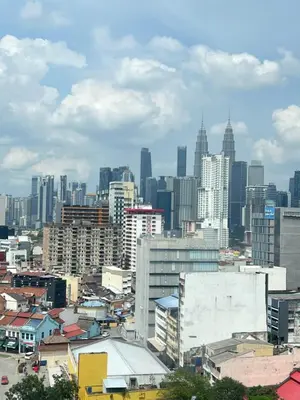 a cityscape of a city with tall buildings at Chambers Auroa Luxury Suites KLCC in Kuala Lumpur