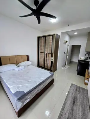 a bedroom with a bed with a ceiling fan at Vista Residence Sentul in Kuala Lumpur