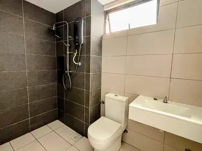 a bathroom with a toilet and a sink and a phone at Vista Residence Sentul in Kuala Lumpur