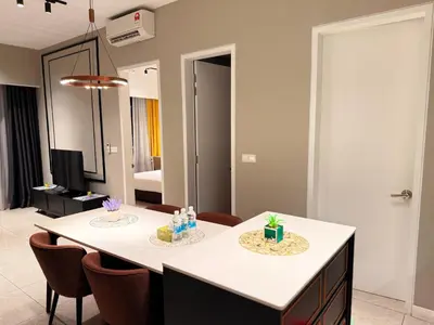a dining room with a table and some chairs at Residensi Akson Bukit Bintang Axon nearby Pavilion TRX in Kuala Lumpur