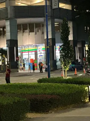 a gas station with people walking in front of it at Residensi Akson Bukit Bintang Axon nearby Pavilion TRX in Kuala Lumpur