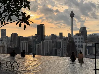 a infinity pool with a view of a city at Residensi Akson Bukit Bintang Axon nearby Pavilion TRX in Kuala Lumpur