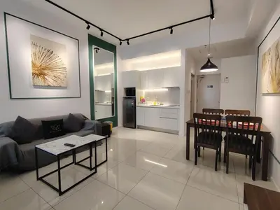 a living room with a couch and a table at Chambers Skypool KLCC in Kuala Lumpur