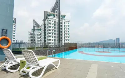 a balcony with chairs and a swimming pool on a building at 3 Towers Jln Ampang by Airhost in Kuala Lumpur