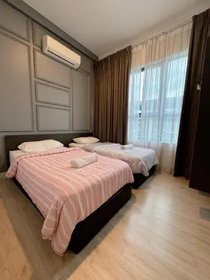 a hotel room with two beds and a window at Comfy Arte Plus Ampang KL City 8 Pax-3BR-2CP in Kuala Lumpur
