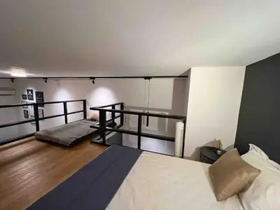 a bedroom with two bunk beds in a room at The Establishment Bangsar #26 by Ouki in Kuala Lumpur
