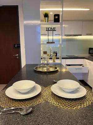 a kitchen with two white bowls on a counter at The Establishment Bangsar #26 by Ouki in Kuala Lumpur