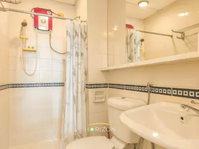 a bathroom with a toilet and a sink and a shower at MayTower by Horizon Homes in Kuala Lumpur