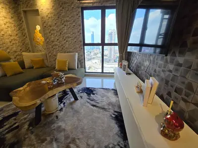 a living room with a couch and a coffee table at Trion Kuala Lumpur For KLCC view BLOCK C in Kuala Lumpur