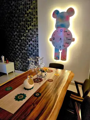a clock that is on the wall above a table at Trion Kuala Lumpur For KLCC view BLOCK C in Kuala Lumpur