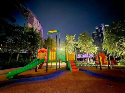 a playground with a slide in a park at night at Trion Kuala Lumpur For KLCC view BLOCK C in Kuala Lumpur