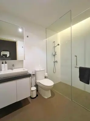 a bathroom with a toilet and a sink and a shower at The Establishment Bangsar #29 by Ouki in Kuala Lumpur