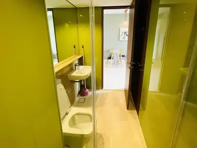 a bathroom with a toilet and a sink at Ludy House in Kuala Lumpur