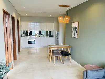 a kitchen and dining room with a table and chairs at Ludy House in Kuala Lumpur