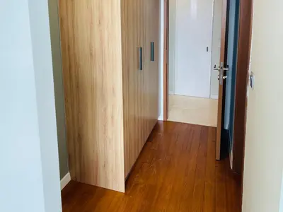 an empty hallway with a door and a wooden floor at Ludy House in Kuala Lumpur