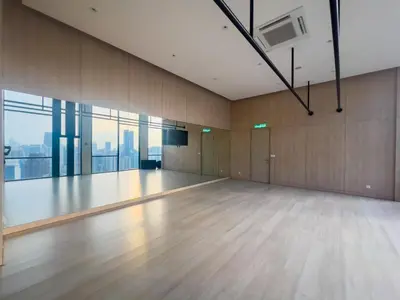 an empty dance floor in a building with windows at Axon Residences KLCC - Premium Suites in Kuala Lumpur