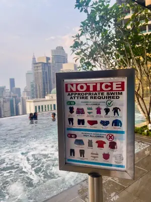 a notice sign in front of a swimming pool at Axon Residences KLCC - Premium Suites in Kuala Lumpur